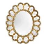 Gold scalloped Murano glass mirror with engraved Venetian detailing, styled for a luxury interior article featured image.